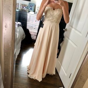 Lulu’s strapless, champagne bridesmaid gown